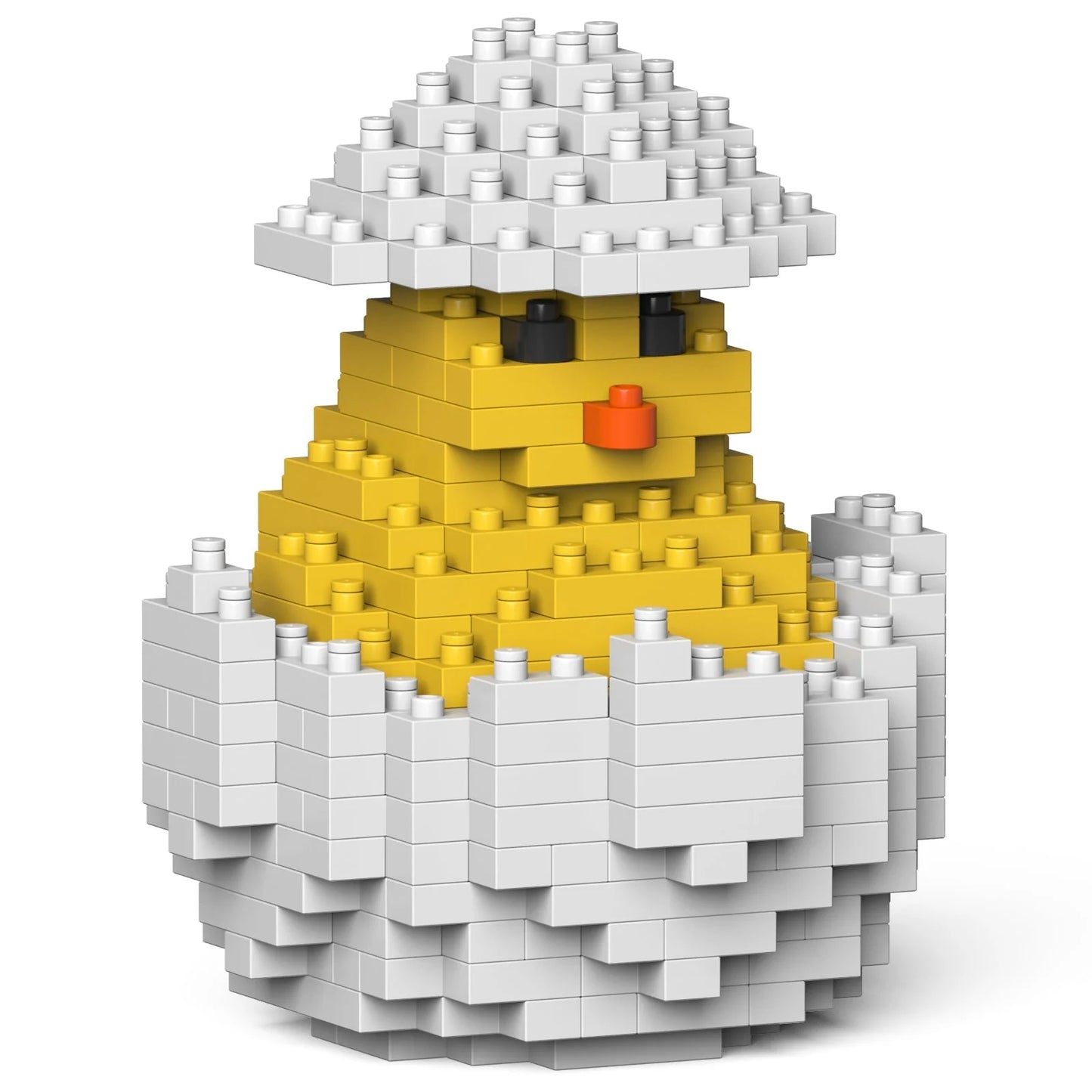Toy figure of a chick in an egg made of interlocking bricks on a white background