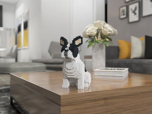 Realistic French Bulldog sculpture made of interlocking plastic bricks displayed as home decor on a wooden shelf next to plants.