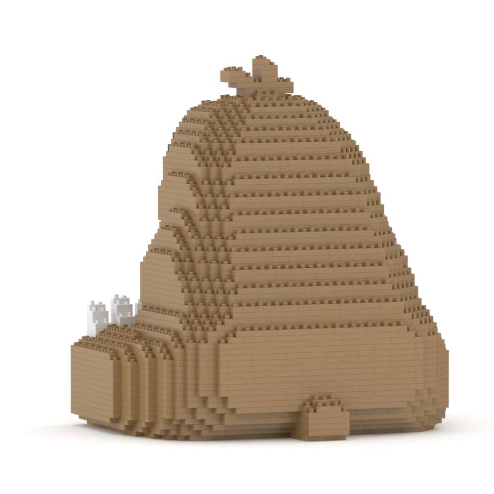 Toy figure of a sloth made from interlocking bricks on a white background