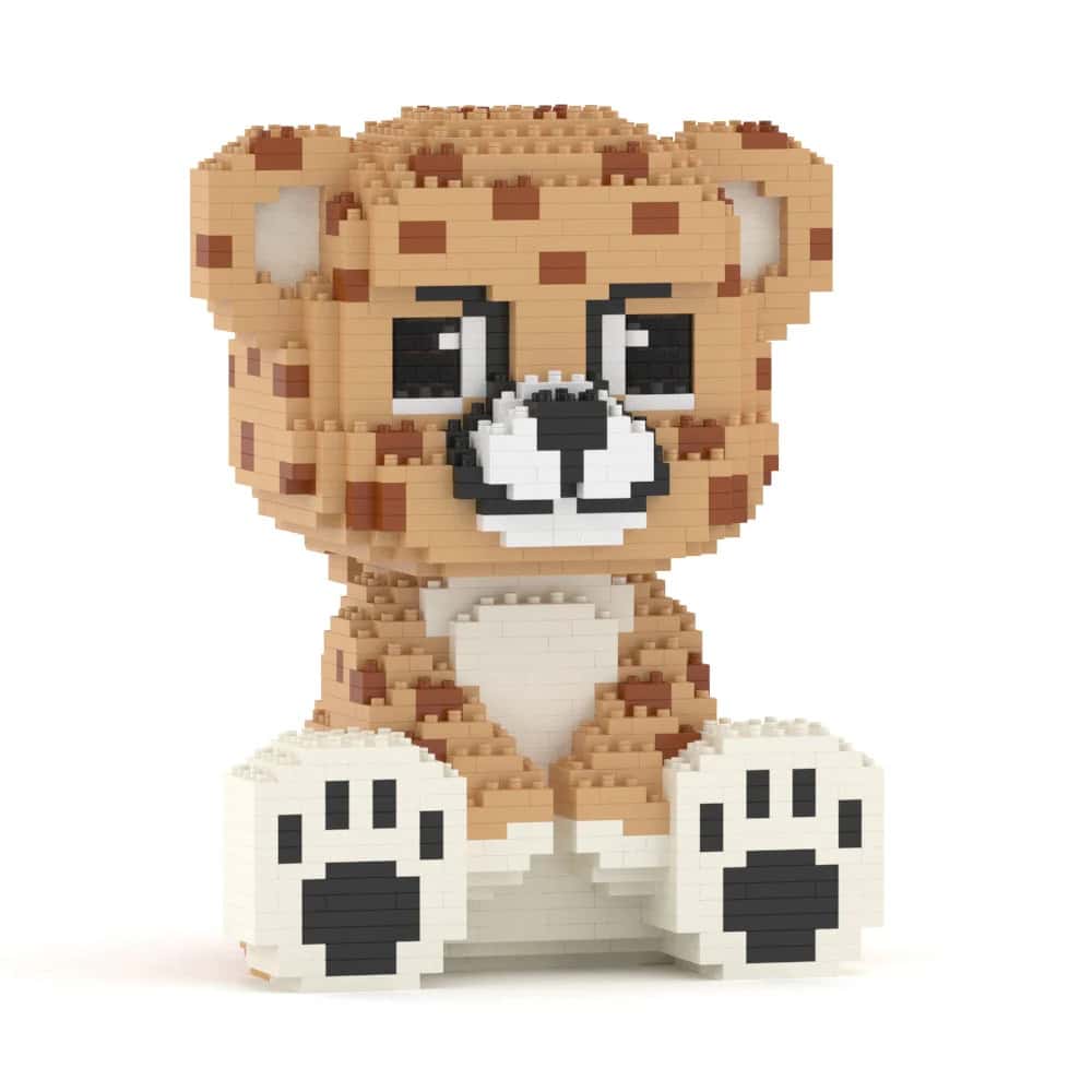 Toy figure of a cheetah made from interlocking bricks on a white background