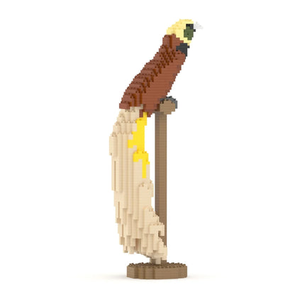An architectural model of a building with a bird of paradise perched on top against a white background