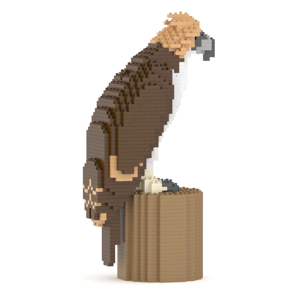 A block-style toy model of a phillipiones eagle bird of prey perched on a cylindrical branch or log, shown on a plain white background.