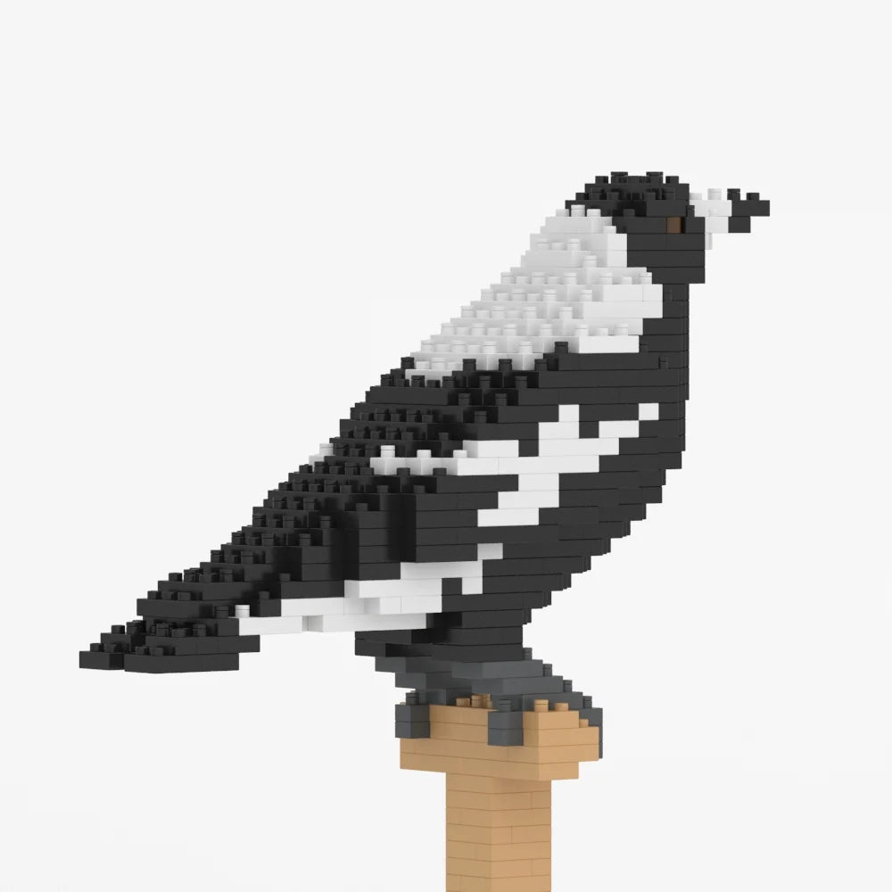 A black and white bird sculpture (australian magpie) built from small interlocking blocks, perched on a tan post against a plain light gray background.