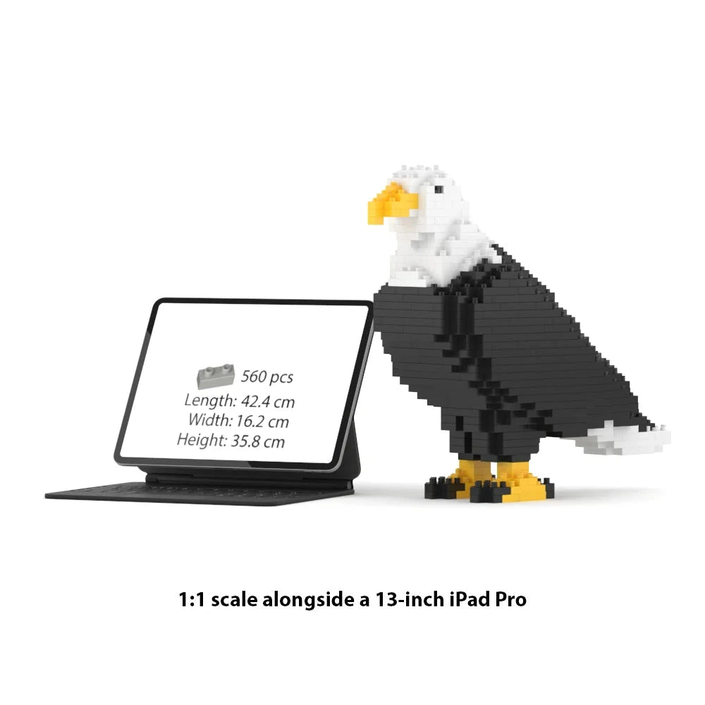A 1:1 scale JEKCA block set of a bald eagle next to a 13-inch iPad Pro, showing the product dimensions on a white background with text at the bottom.
