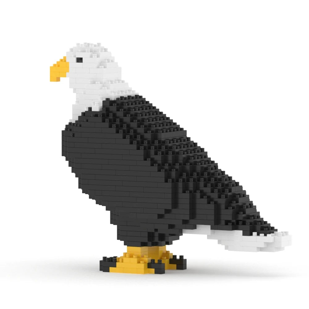 A block-style eagle figurine made of black, white, and yellow building bricks, shown in profile on a clean white background.