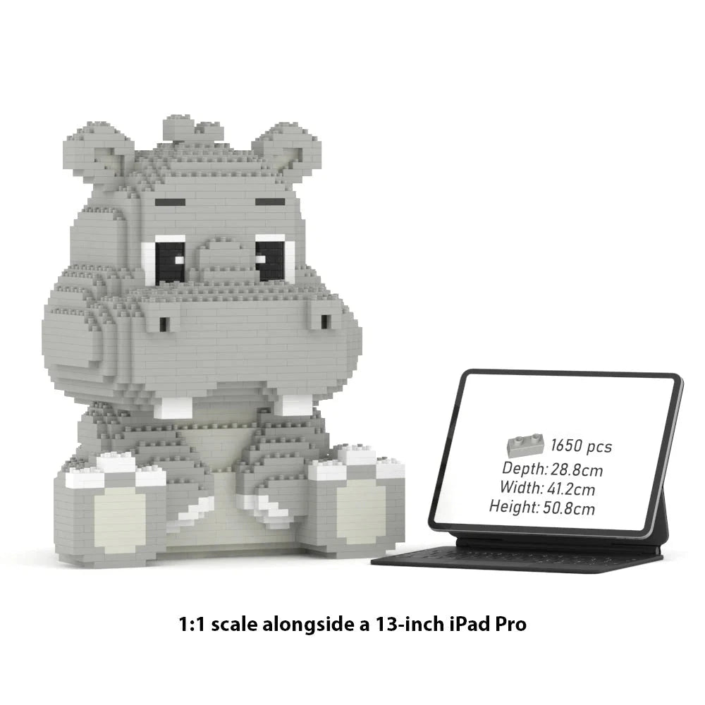 A 1:1 scale block-style hippo toy model shown beside a tablet displaying product specs. The hippo is built from light gray and white interlocking blocks and sits on a white background with text reading '1:1 scale alongside a 13-inch iPad Pro.