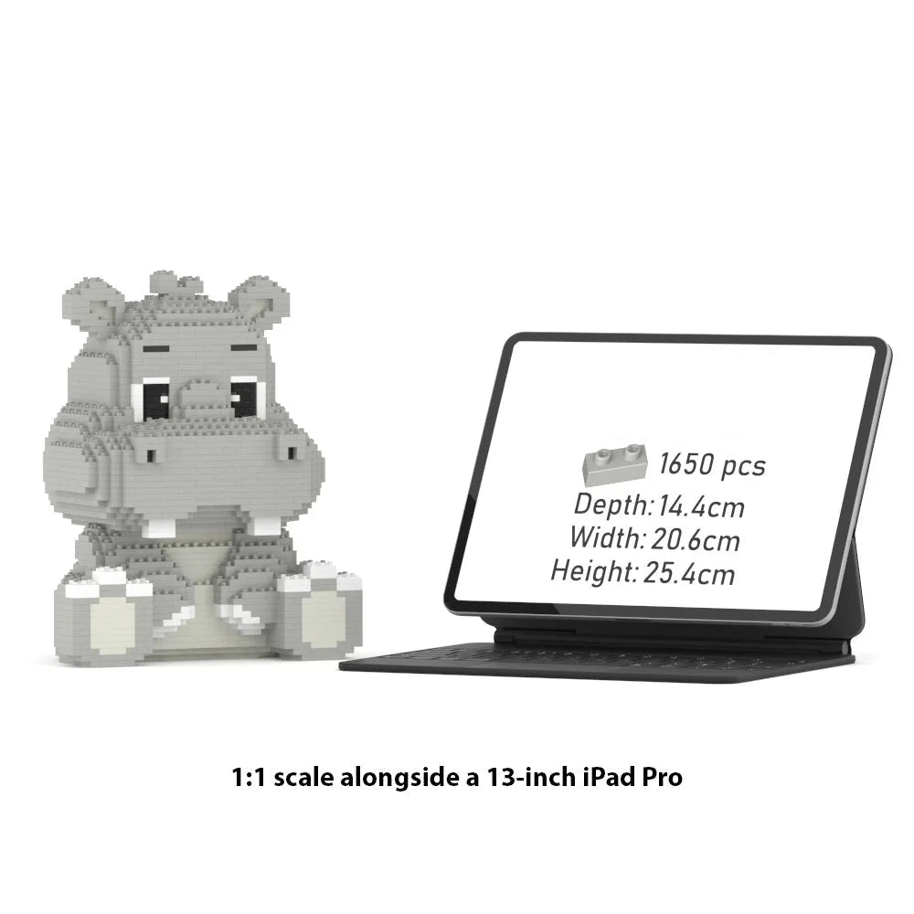 A gray hippo-shaped building block set displayed beside a tablet showing product details, with text below stating 1:1 scale alongside a 13-inch iPad Pro.