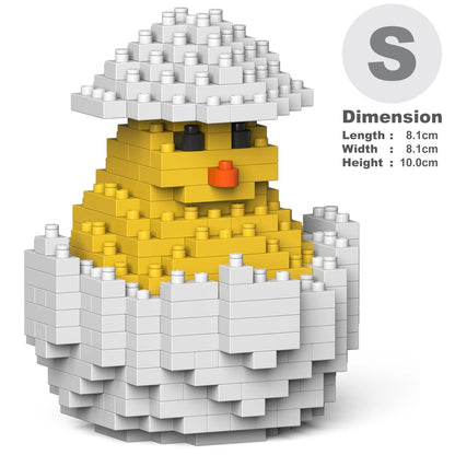 A small yellow chick toy built from interlocking block pieces, shown cracked open with white pieces around it. The image includes a dimension label on the right with size measurements and a large letter S.