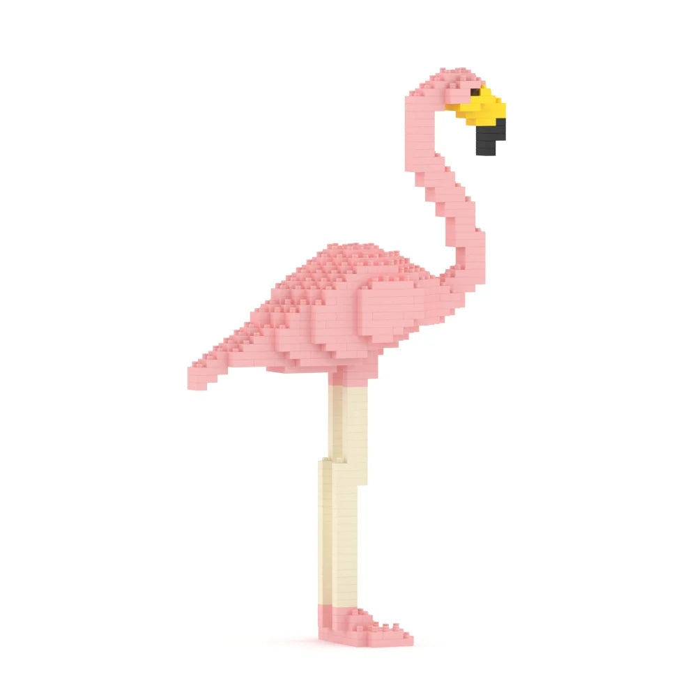 A pink flamingo figure built from small interlocking blocks, shown standing on a plain white background. The head and beak are yellow with a small black accent, and the legs are a pale cream color.