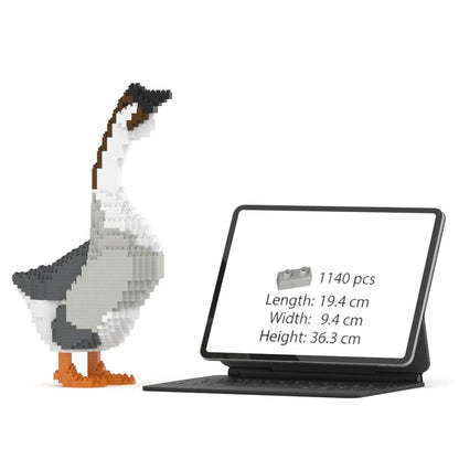 A jekca geese building block set shown alongside a tablet displaying product details. The tablet screen shows product details: 1140 pieces, and dimensions
