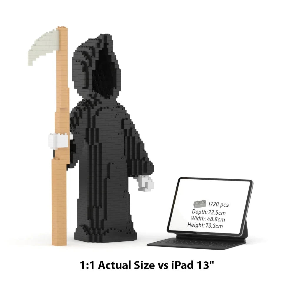 A black LEGO-style grim reaper block set holding a scythe, shown next to an iPad displaying product dimensions and a text overlay reading '1:1 Actual Size vs iPad 13"'.