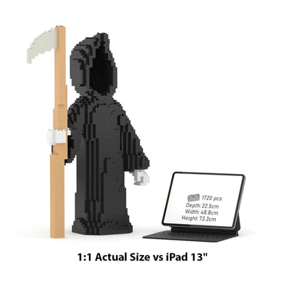 A black LEGO-style grim reaper block set holding a scythe, shown next to an iPad displaying product dimensions and a text overlay reading '1:1 Actual Size vs iPad 13"'.