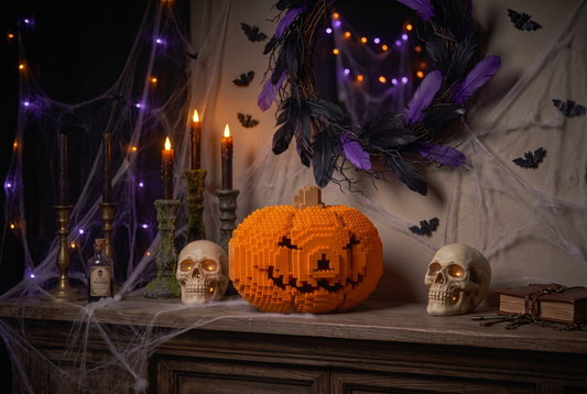 A Halloween-themed scene with a carved orange pumpkin made of interlocking blocks centered on a wooden mantel, flanked by two skulls, black candles, spiderwebs, purple and black feathers in a wreath, and small bat cutouts against a dark wall.