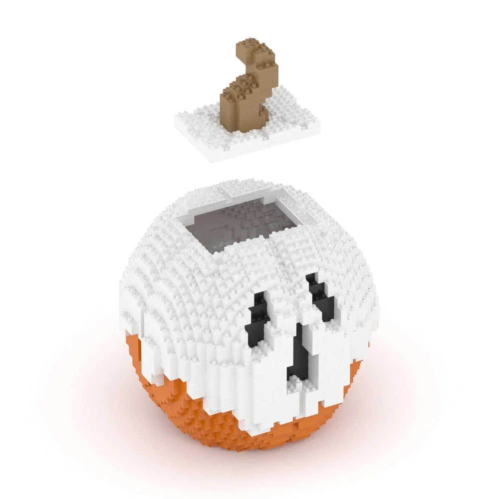 A small block-built toy structure shaped like a ghost-faced pumpkin or jack-o'-lantern, with a white upper portion, orange lower portion, black facial features, shown on a clean white background.