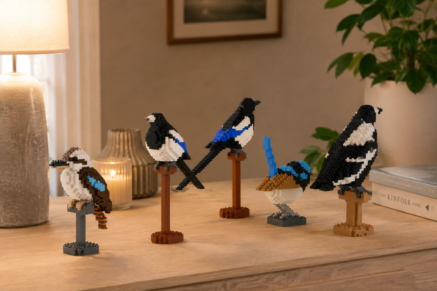 various birds, magpie, kookaburra, Fairywren standing on the table in a cozy room
