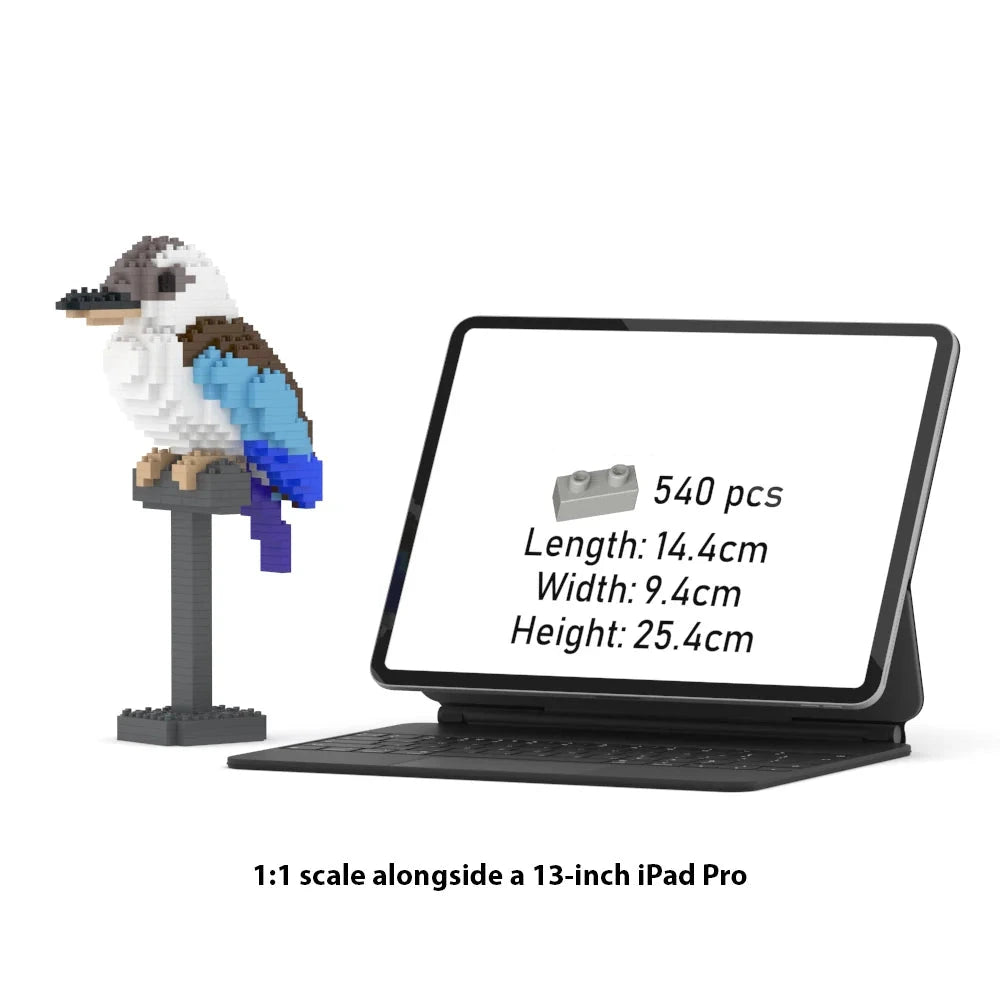 A 1:1 scale brick model of a kookaburra on a stand, shown next to a 13-inch iPad Pro displaying the product specifications. The text at the bottom reads '1:1 scale alongside a 13-inch iPad Pro'.