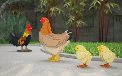 Three block-built toy animals resembling a rooster, hen, and two chicks standing on a gray path with green grass and bamboo in the background.