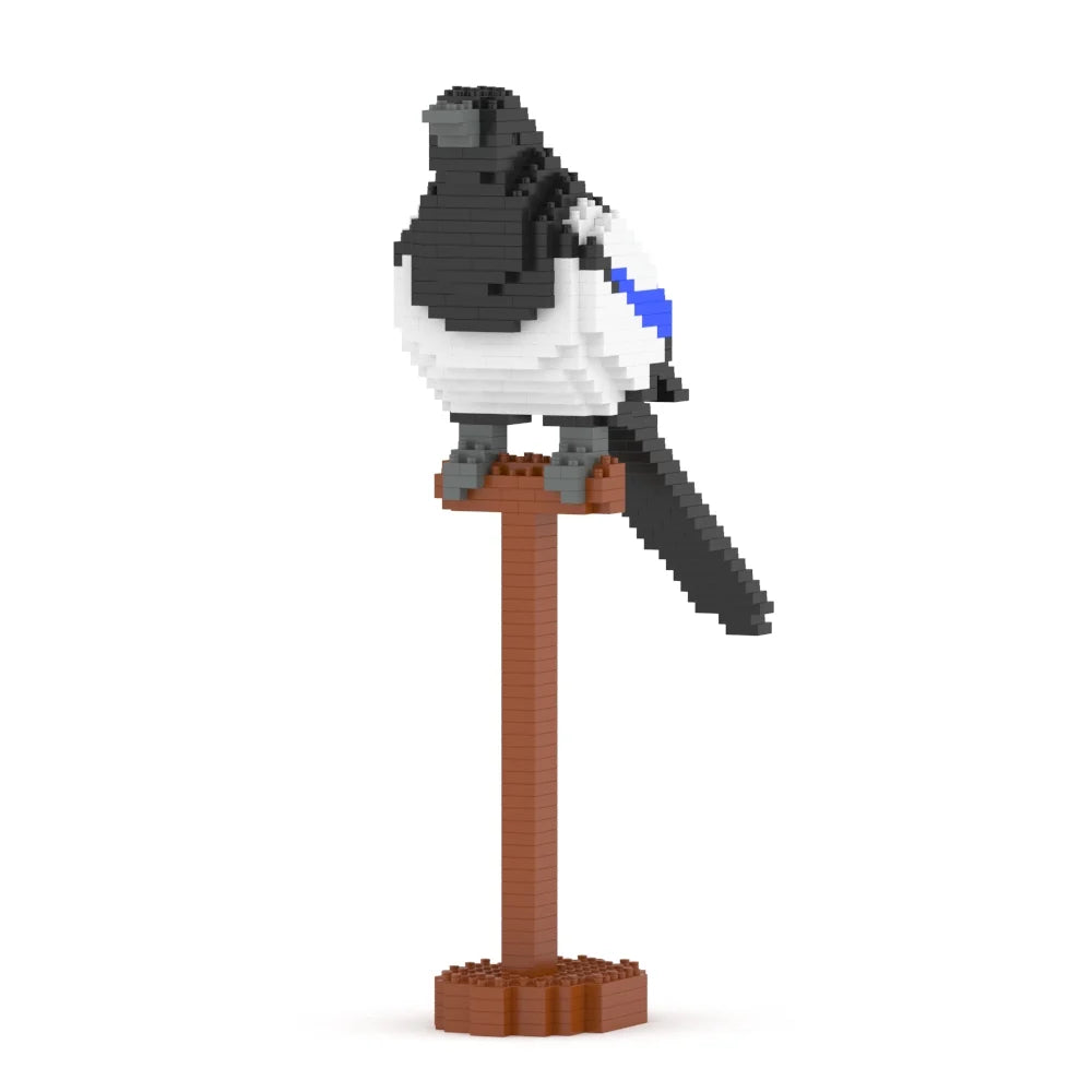 A small bird figurine built from block-like pieces, perched on a brown pole with a round base, shown on a plain white background.