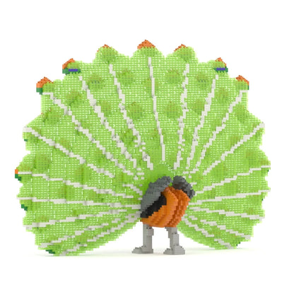 A 3D block puzzle model of a peacock with a bright green body, orange and black chest, and a large fanned tail displaying green, white, and orange spots, set against a plain white background.
