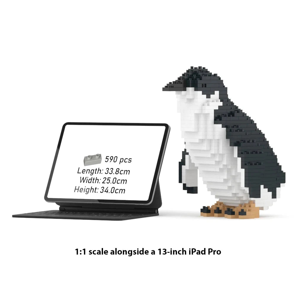 A 1:1 scale penguin building block set shown beside a 13-inch iPad Pro on a white background. The product includes 590 small blocks.