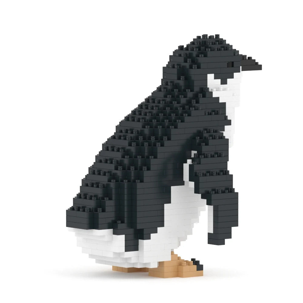 A penguin-shaped building block sculpture made of black, white, and tan micro-bricks, shown on a clean white background.