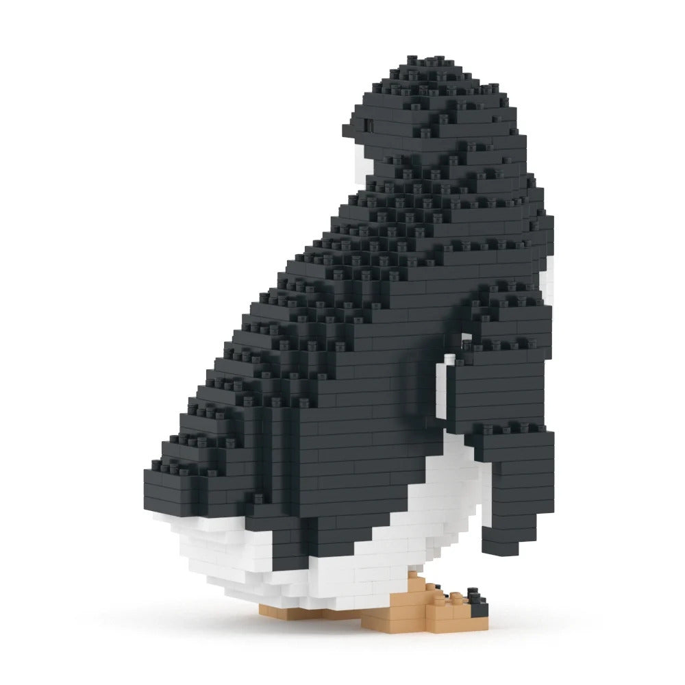 A penguin-shaped building block model constructed from black and white blocks with small tan feet, shown on a clean white background.
