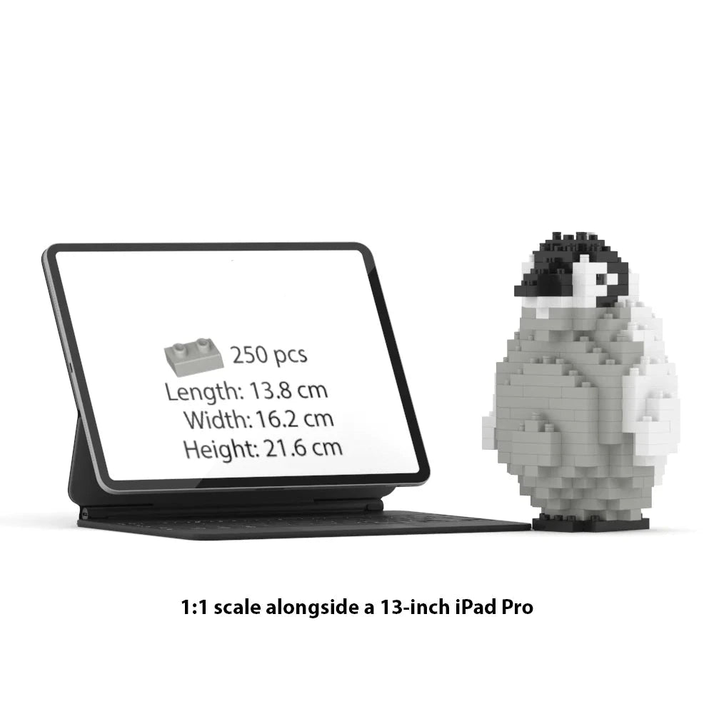 A Jecka brick set box shown on a tablet screen next to a small assembled penguin figure, with text reading '1:1 scale alongside a 13-inch iPad Pro'.