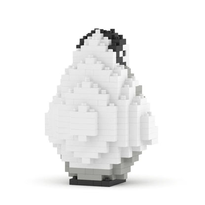 A small pixelated penguin figure built from white, gray, and black interlocking blocks, standing on a white background with a soft shadow underneath.