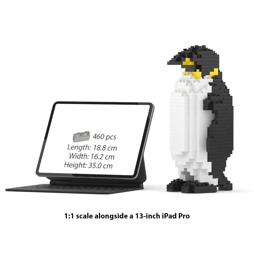 A JEKCA 1:1 scale penguin building block set shown next to a 13-inch iPad Pro for scale comparison, on a clean white background with text indicating the product details.