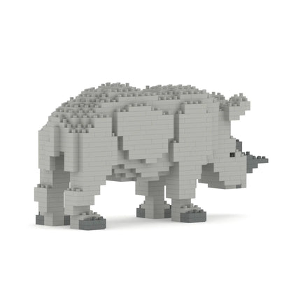 Gray rhino sculpture made of interlocking bricks on a white background facing away