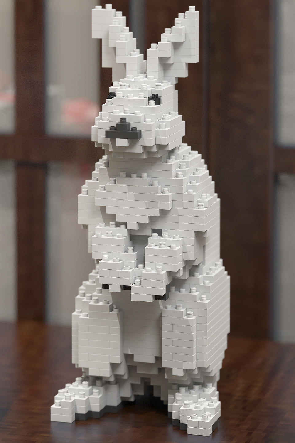 White rabbit figure made of interlocking bricks on a wooden surface