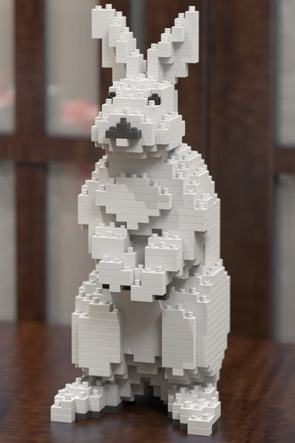 White rabbit figure made of interlocking bricks on a wooden surface