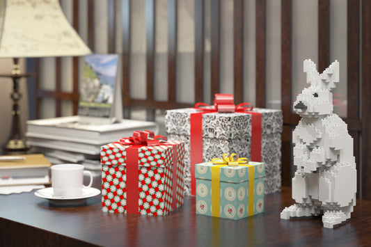 white rabbit made of building blocks on the table with gift boxes