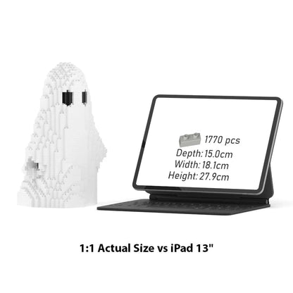 A white ghost-shaped building block model shown beside an iPad in a black keyboard case on a white background, with text below reading '1:1 Actual Size vs iPad 13"'. The iPad screen displays product details.