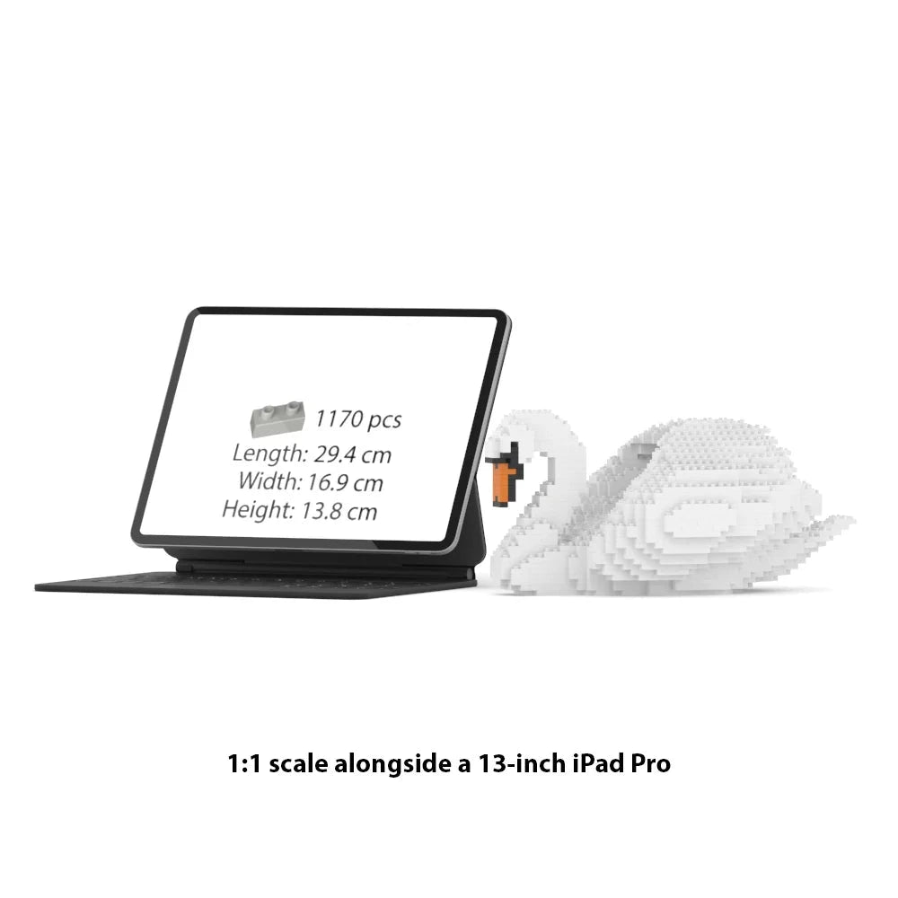A 1:1 scale brick model of a swan shown next to a 13-inch iPad Pro on a white background, with text indicating the model has 1170 pieces and dimensions of 29.4 cm length, 16.9 cm width and 13.8 cm height